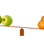 oranges and apples on scale